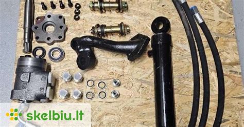 Nuotrauka, lyginanti hidraulinio ir elektrinio vairo komponentus