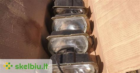 Palyginimas: Mercedes-Benz EQS automobilio žibintai su defektais ir tie patys žibintai po apsauginės plėvelės aplikacijos.