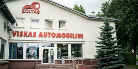 EOLTAS logotipas ir modernios autodalių parduotuvės interjeras