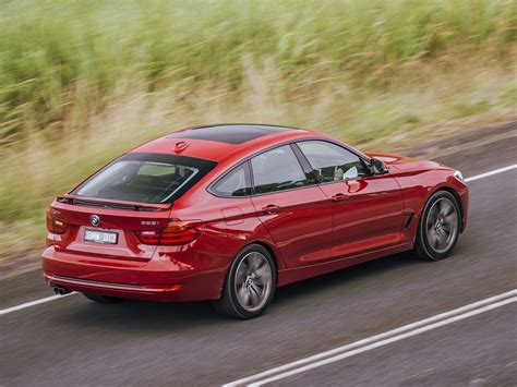 Thematic photo of a BMW 3 Series Gran Turismo (F34) and a BMW 5 Series Gran Turismo (F07) side-by-side or in dynamic motion, showcasing their unique design.