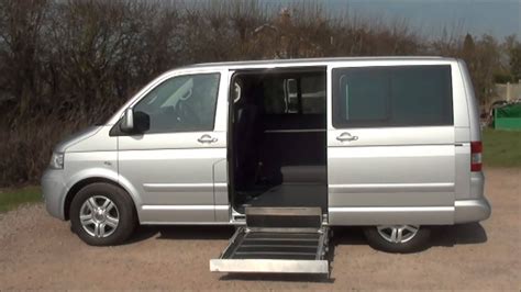 VW Caravelle adapted for wheelchair access, showing a ramp or lift mechanism
