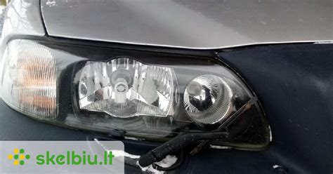 schematinis brėžinys, kaip nuimti priekinį žibintą „Volvo V50“