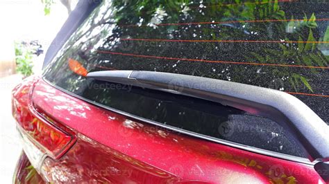 Thematic photo of a car wiper cleaning a rear window