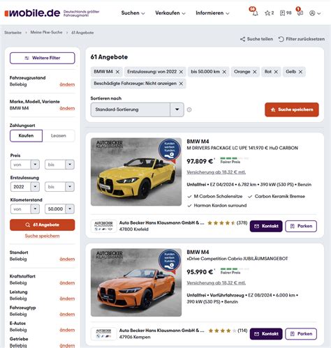 Vokietijos automobilių rinka, mobile.de logotipo fragmentas, automobiliai aikštelėje