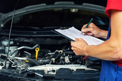 Photo of a car being inspected in a service station