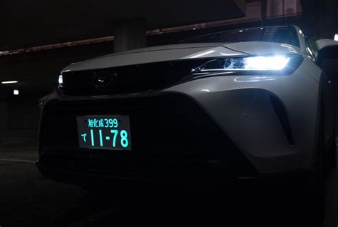 Thematic photo of a car's license plate light illuminated at night