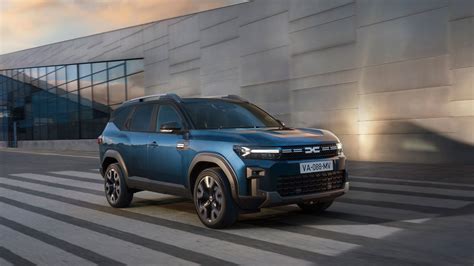 Thematic photo of a modern Dacia car driving on a road, with a focus on its design and technology.