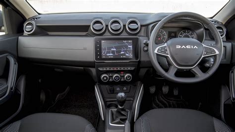 Dacia Duster interior showing the central screen and digital dashboard.