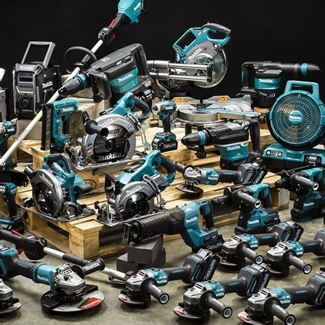 Thematic photo of various MAKITA power tools and accessories, including batteries, neatly arranged in a workshop setting