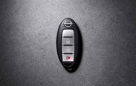 AST mygtukas ant automobilio radijo imtuvo