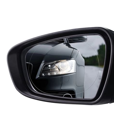 Vaizdas iš automobilio šoninio veidrodėlio su įspėjimu apie automobilį aklajame zonoje
