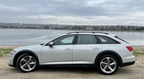 Audi A6 C7 Allroad with R18 winter wheels on a snowy road