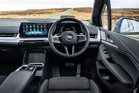 Infographic of BMW 2 Series Active Tourer interior and dashboard with driver assistance systems highlighted