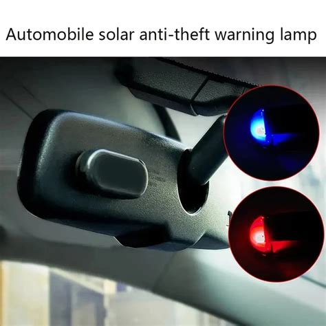 Thematic photo of a car with an active alarm system light