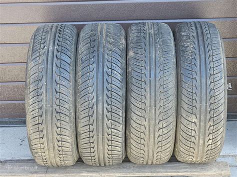 Vizualizacija: scheminis automobilio padangos pjūvis su pažymėtomis pagrindinėmis dalimis (protektorius, šoninė sienelė, karkasas, bortai).