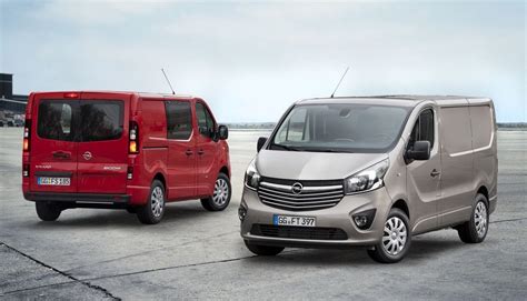 Thematic photo of various cars for sale in a lot, possibly a Mercedes-Benz G-Class, Renault Trafic, Opel Vivaro in the foreground.