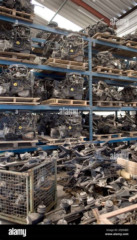Thematic photo of various car parts from a scrapyard or warehouse
