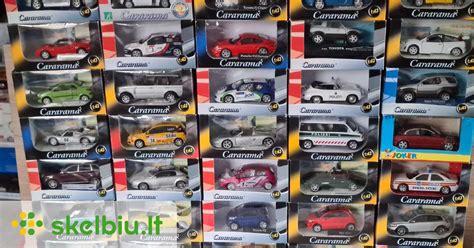 Teminė nuotrauka: įvairūs ekonomiški automobilių modeliai, stovintys prie degalinės