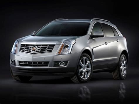 Nuotrauka, vaizduojanti Cadillac SRX prietaisų skydelį ir CUE sistemos valdymo elementus