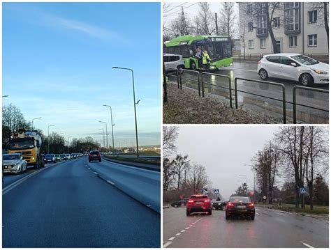 Teminė nuotrauka, vaizduojanti Taikos prospektą Kaune su automobilių eismu ir aplinkinėmis įmonėmis