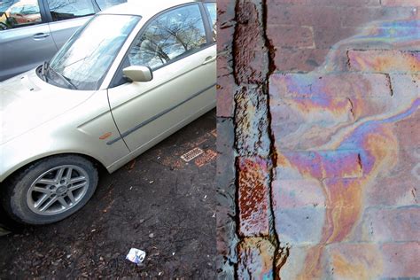 Nuotrauka, vaizduojanti skysčio dėmę po automobiliu, kaip galimą nuotėkio požymį.