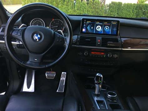 BMW E60 multimedijos sistemos valdymo panelė ir ekranas