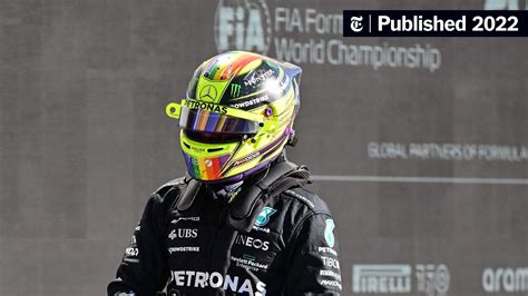 Photo of a racing driver wearing full safety gear