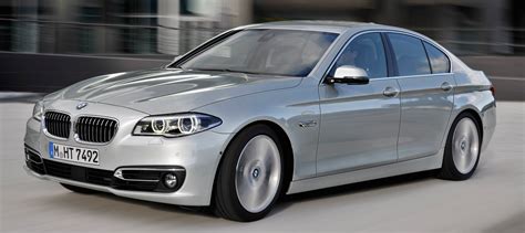 Thematic photo of a BMW F10 sedan with stylish original rims