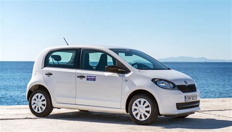 The Skoda Citigo, a compact city car, shown in an urban environment to highlight its small size and maneuverability.