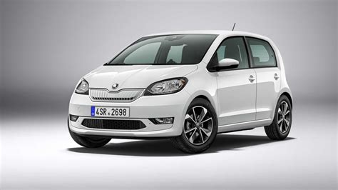A Skoda Citigo iV being charged at an electric vehicle charging station.