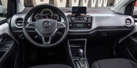 An interior shot of the Skoda Citigo, showcasing its minimalist dashboard and practical layout.
