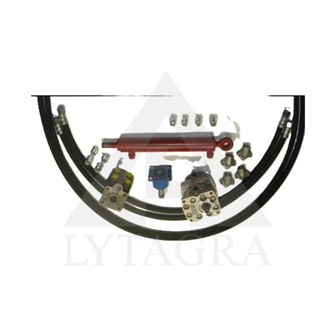 T-25 traktoriaus priekinė ašis su sumontuotu hidrauliniu cilindru