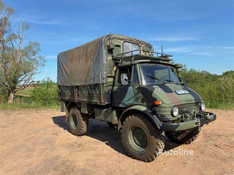 Sunkvežimio „Unimog“ važiuoklės su portalinėmis ašimis ir stumiančiojo vamzdžio konstrukcija iliustracija