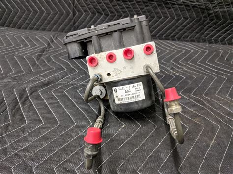 BMW E46 ABS bloko komponentų schema (hidraulinė ir elektroninė dalys)