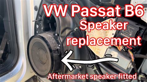 Photo of a VW Passat B5 door panel with a speaker adapter installed