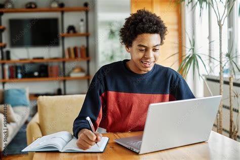 Thematic photo of a person studying KET tests on a tablet or laptop at home