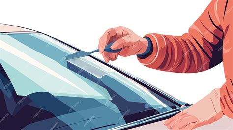 Photo of a car windshield technician preparing for replacement, with specialized tools visible