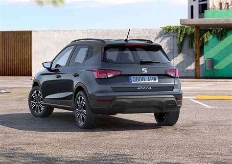 The sleek, sporty exterior of the Seat Arona, showcasing its sharp lines, angular headlights, and trapezoidal grille.