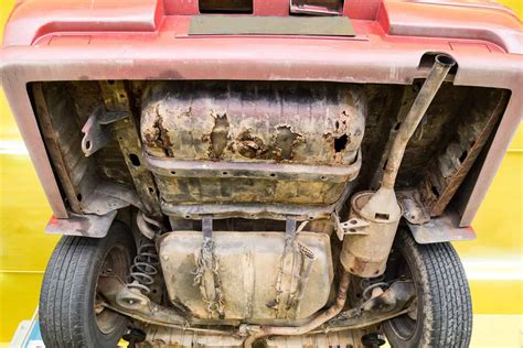 An close-up on a rusty car part or undercarriage, illustrating common corrosion issues