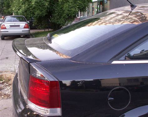 Opel Vectra C bagažinės dangčio mygtuko ir jo vietos nuotrauka