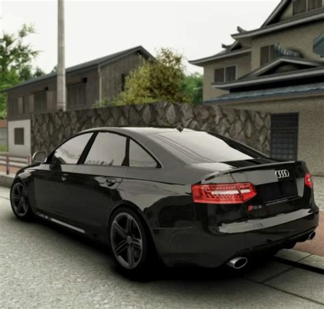 Teminė nuotrauka: Audi A6 C6 važiuojantis kelio paviršiumi