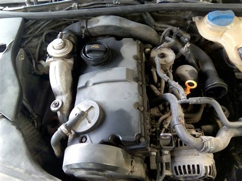 The 1.9 TDI engine bay in a VW Passat B5, highlighting the accessory belt and tensioner location