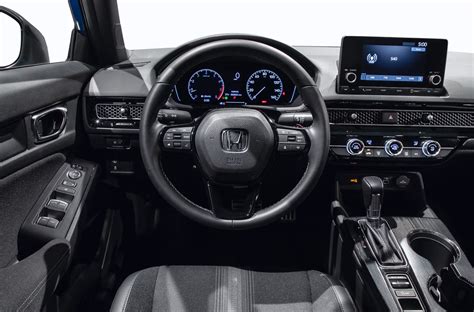 Interior of an 8th-generation Honda Civic, showcasing its futuristic dashboard and spacious cabin.