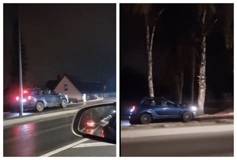Automobilis važiuoja lėtai šlapiu keliu