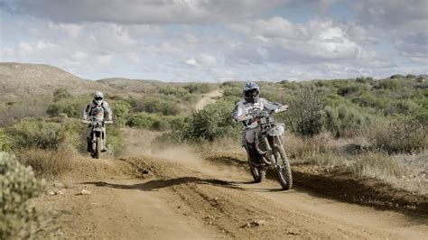 Dynamic photo of Nicola Dutto racing on his motorcycle in the desert