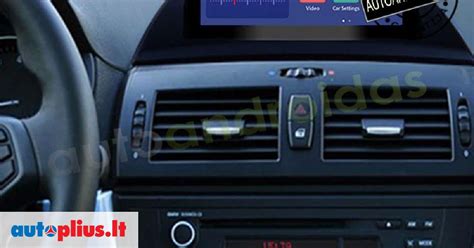 Iliustracija, vaizduojanti BMW navigacijos sistemos valdymo bloką ir CD grotuvą
