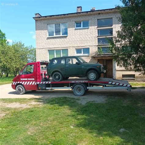 Tematinė nuotrauka: Automobilis ant tralo, transportuojamas iš Švenčionių