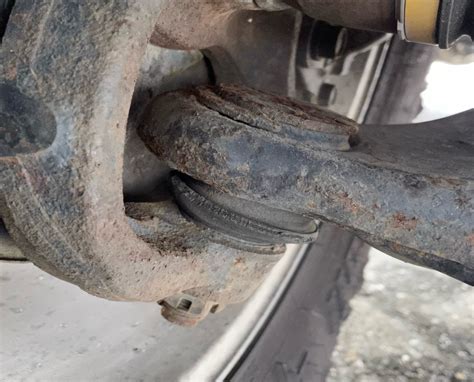 close-up photo of a worn-out car ball joint