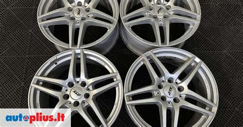 Automobilis su ATS R18 ratlankiais, pabrėžiantis jų dizainą ir dydį
