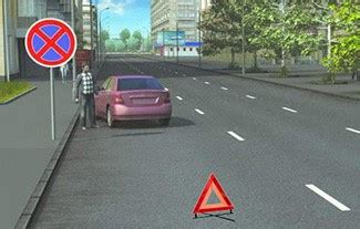 Nuotrauka, vaizduojanti saugų automobilio vilkimą su aiškiai matomu lynu ir avarinės šviesos signalizacija